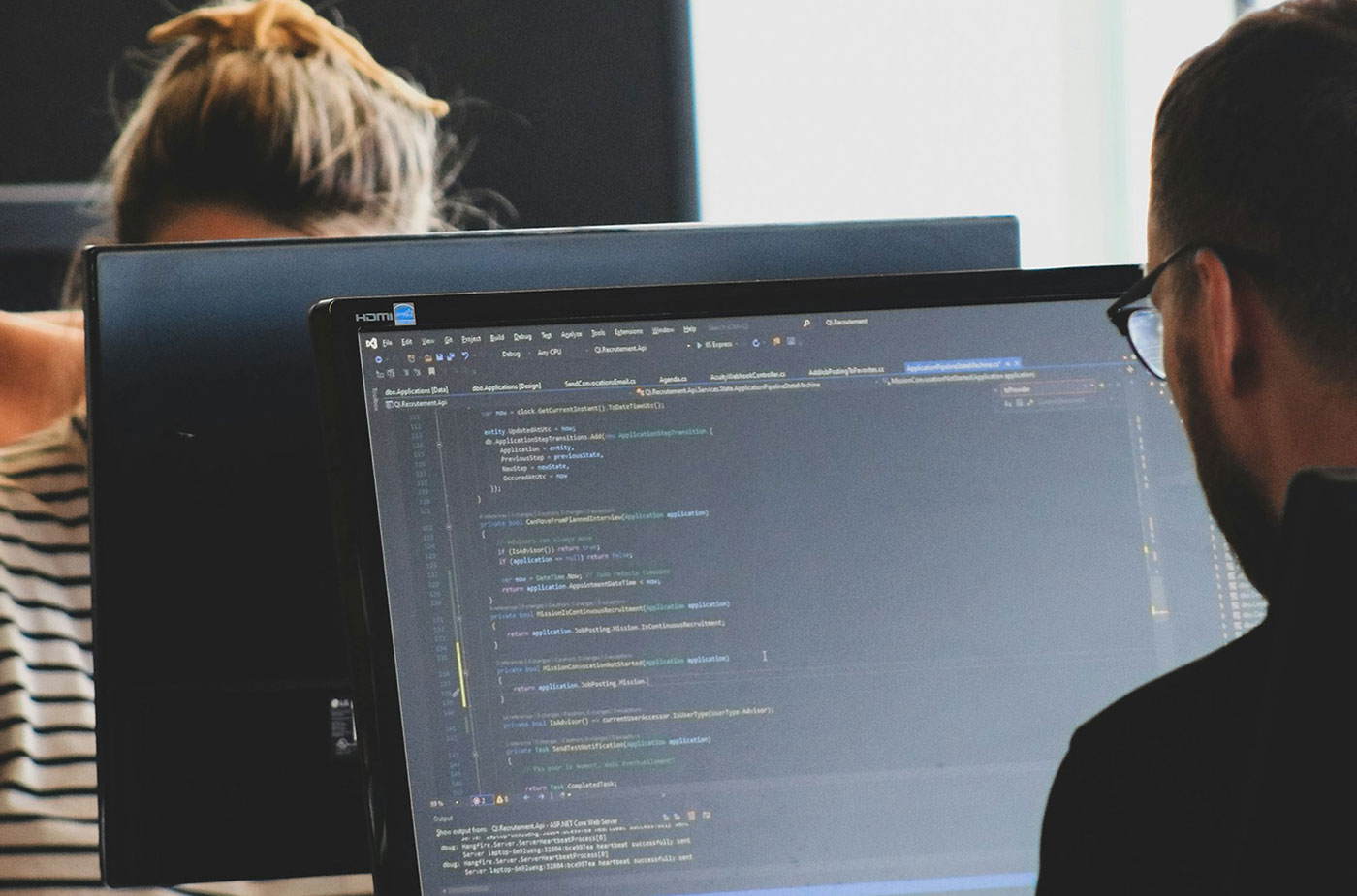 TRU cybersecurity students writing code.